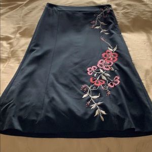 Black pencil/A-line skirt, red/pink embroidery